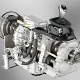 Przekrój zaawansowanej skrzyni DCT z widocznym mechanizmem sprzęgła, wałkami i selektorem biegów.