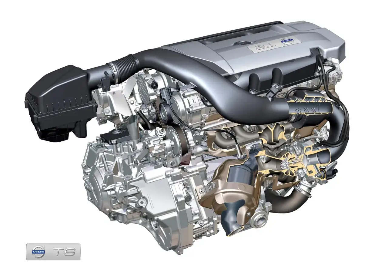 Silnik Volvo T6 w przekroju, ukazujący turbosprężarkę i skomplikowane elementy mechaniczne.